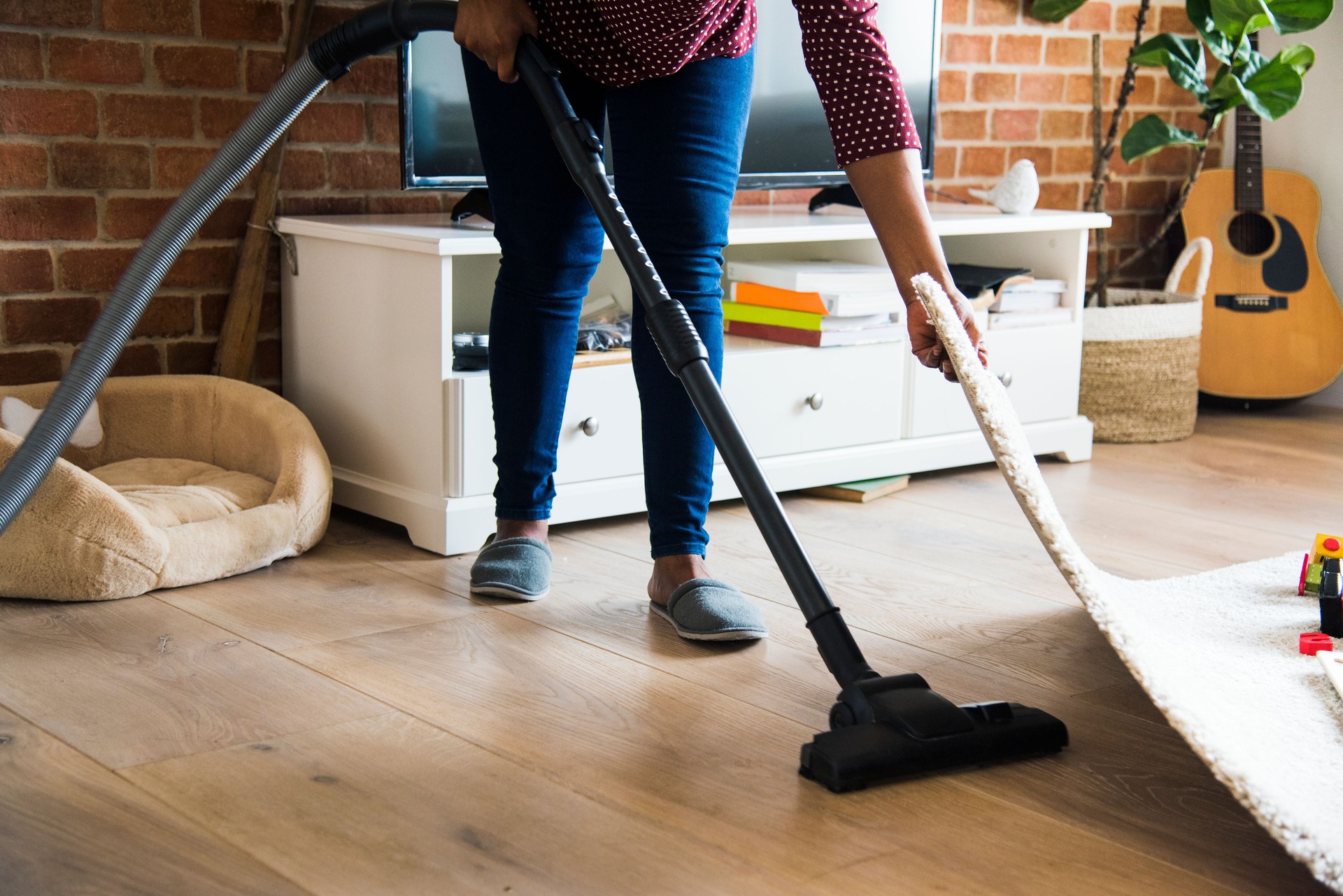 Black woman is cleaning room